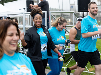 ASCP 2023 attendees smiling and running at 5K